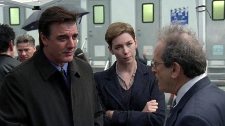 Mike Logan, Megan Wheeler, and Dr. Jacoby standing next to each other in Law & Order: Criminal Intent