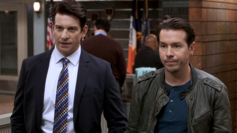 Mike Dodds and Antonio Dawson standing next to each other in the police station in Law & Order: SVU