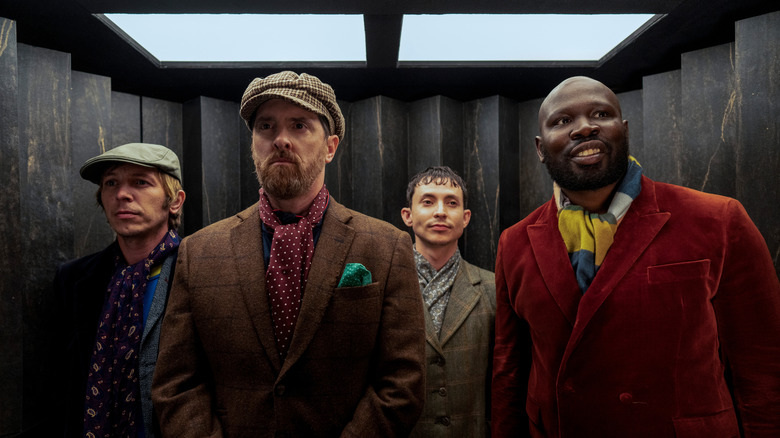 Coach Beard with the side characters from the bar (played by Bronson Webb, Adam Colborne, and Kevin 'KG' Garry) in "Ted Lasso"
