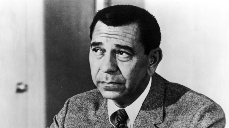 Star of the TV series "Dragnet" Jack Webb performs in a scene in circa 1955.