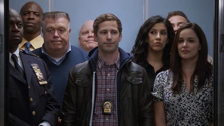 The "Brooklyn Nine-Nine" squad standing in an elevator