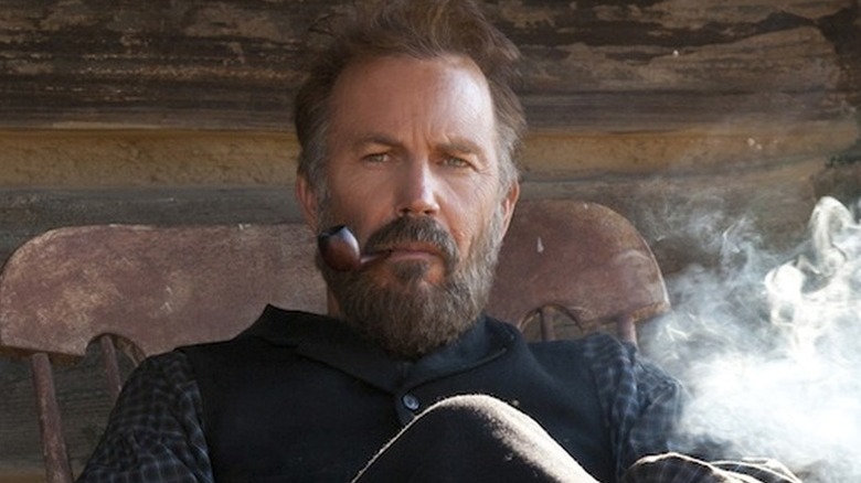 Devil Anse Hatfield smoking a pipe on Hatfields & McCoys