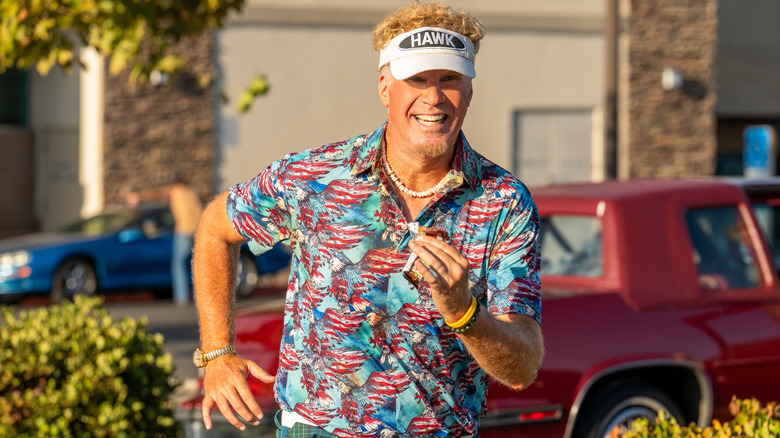 Will Ferrell as Lonnie Hawkins, wearing a Hawk cap and blue shirt with striped eagles.