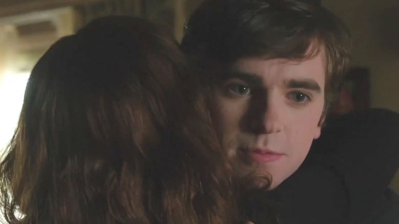 Freddie Highmore as Norman Bates hugging a woman in "Bates Motel."