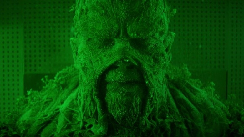 Swamp Thing lit by green light in "Swamp Thing" (2019)