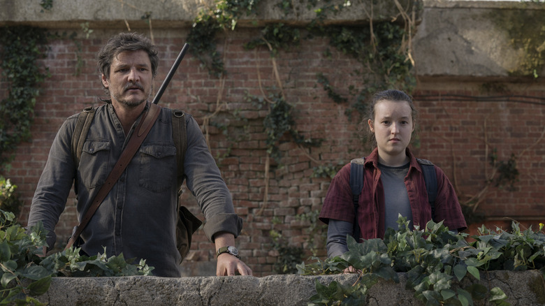 Joel and Ellie stand together in an outdoor space in "The Last of Us" (2023)