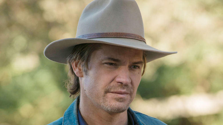 Close-up of Raylan Givens in a tan hat, looking down in mild disgust, in Justified (2010)