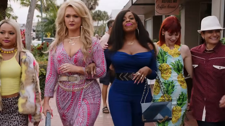 The main cast of "Claws" walking down the street