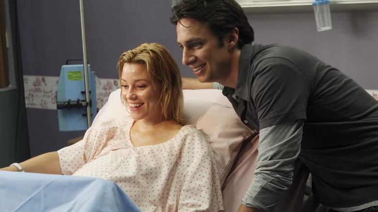 Kim and JD smiling after Kim has given birth in "Scrubs"