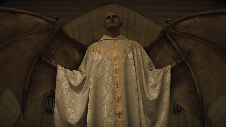 The Angel wearing white and gold Catholic priest vestments