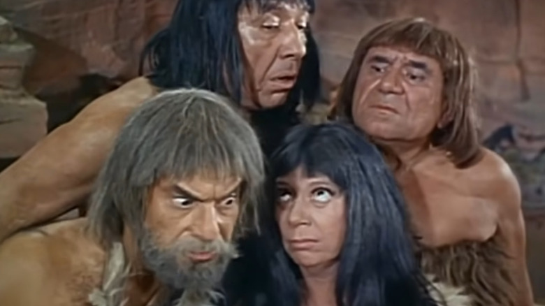 Frank Aletter as Mac and Jack Mullaney as Hector in astronaut uniforms standing across from Pat Cardi as Greer, Joe E. Ross a Gronk, and Imogene Coca as Shad in cavemen outfits in It's About Time