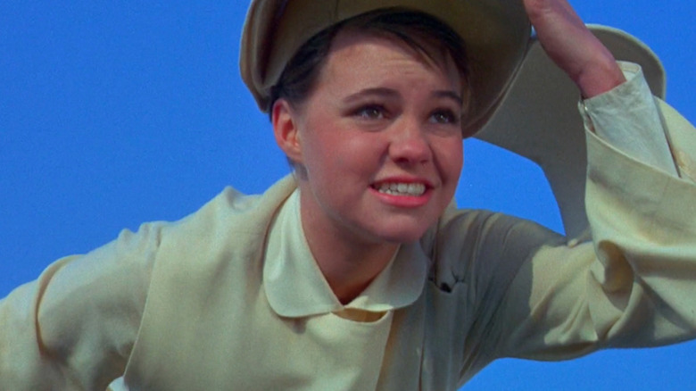 Sally Field as Sister Bertrille, "flying" in nun habit with blue background in The Flying Nun