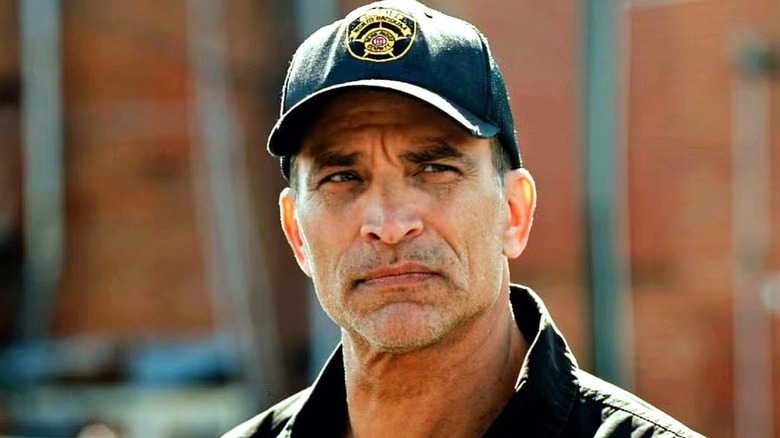 Justin Wise (Johnathon Schaech) standing on the street on "Blue Ridge: The Series."