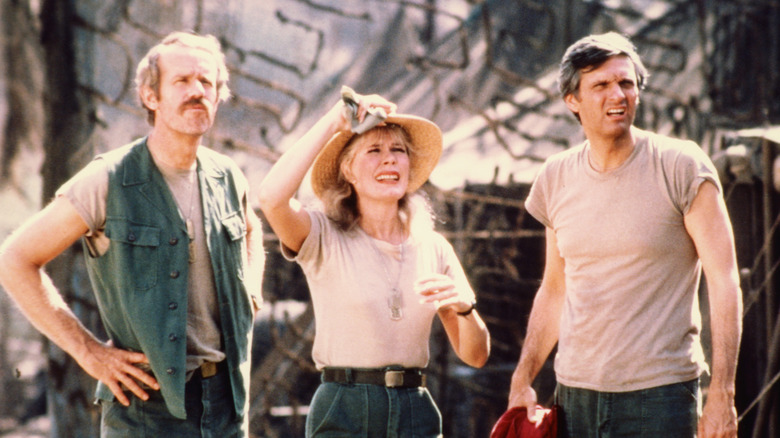 Hawkeye, Houlihan, and B. J. Hunnicutt in their camp in "M*A*S*H" (1972)