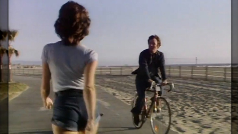Suzanne Somers as the brunette walking past John Ritter on his bike during the opening credits of "Three's Company"