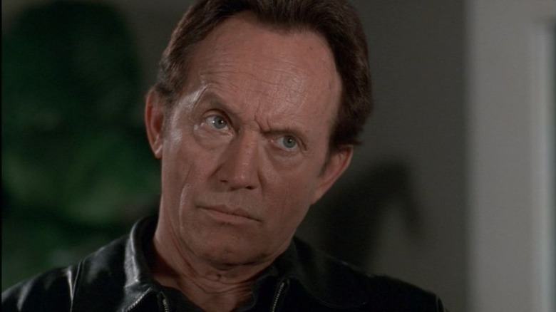 Lance Henriksen as Frank Black looks grim in Millennium