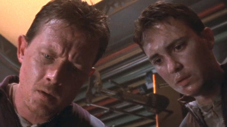 Robert Patrick as Major John Skokes stands next to a kid in The Outer Limits
