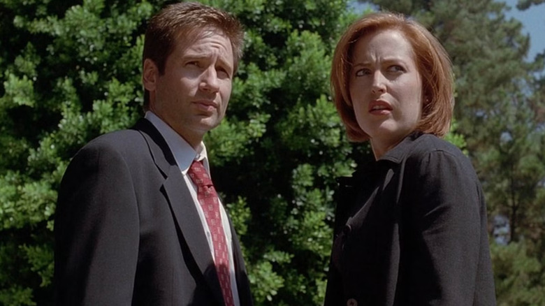 David Duchovony as Fox Mulder and Gilliam Anderson as Dana Scully look worried in The X-Files