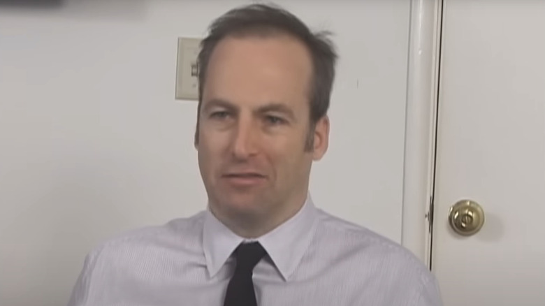 Bob Odenkirk sits in a chair in his audition for The Office