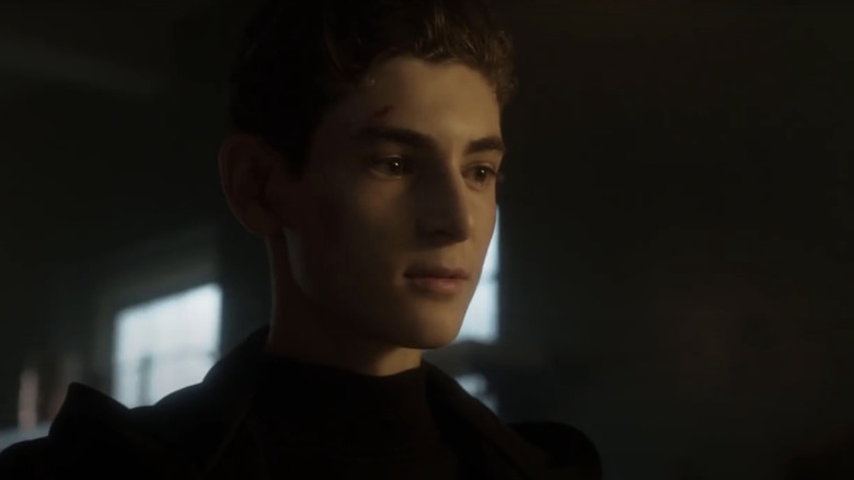 David Mazouz's Bruce Wayne is seen in closeup in a dark room in Gotham