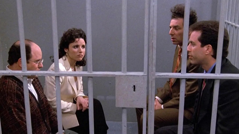 George, Elaine, Kramer, and Jerry sitting in a jail cell on "Seinfeld" (1989-1998)