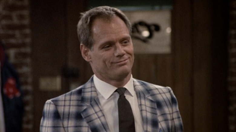 Fred Dryer's Dave Richards stands in the bar in "Cheers"