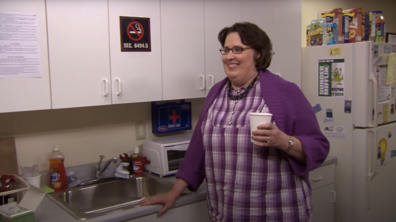 Phyllis Smith's Phyllis Vance smiles as she stands in the kitchen in The Office