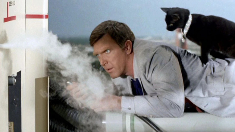 Gary Seven lying on a smoking rocket with his black cat, Isis, on his back