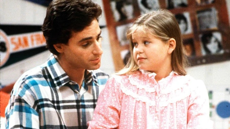 D.J. Tanner looking concerned at Danny Tanner