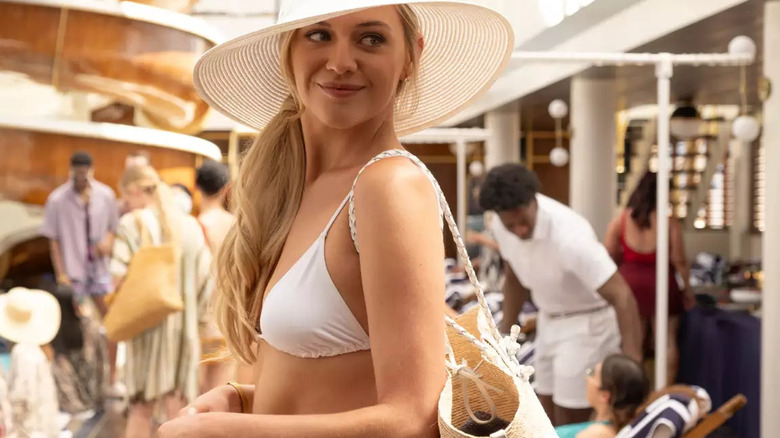 Bridezilla Lisa Parsons smiling in a white bikini and matching sun hat on Doctor Odyssey