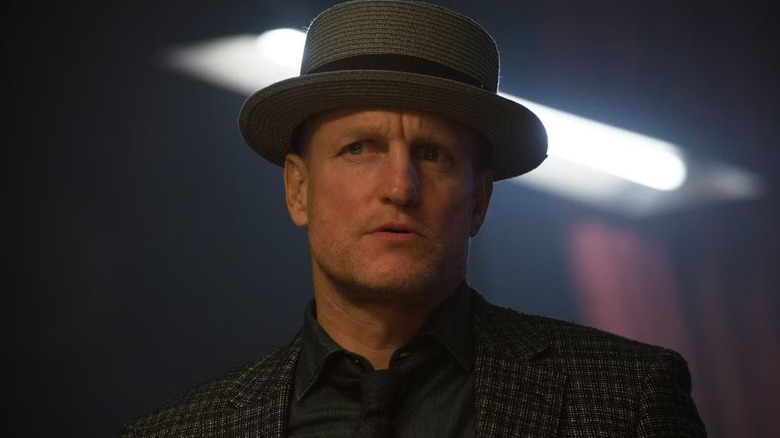 Merritt McKinney wearing a bowler hat and plaid suit jacket in Now You See Me