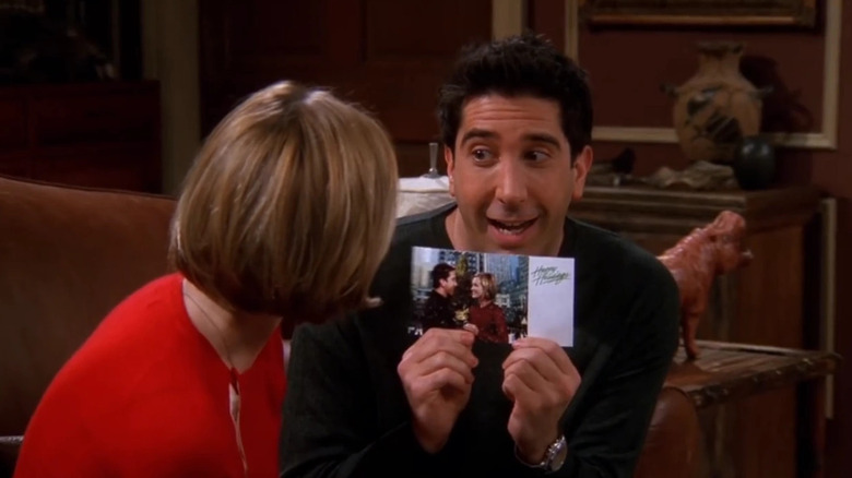 David Schwimmer as Ross, presenting Mona with a card on Friends.