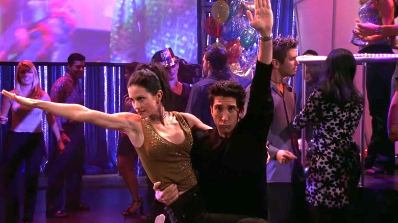 Courtney Cox and David Schwimmer as Monica and Ross, dancing together on Friends.
