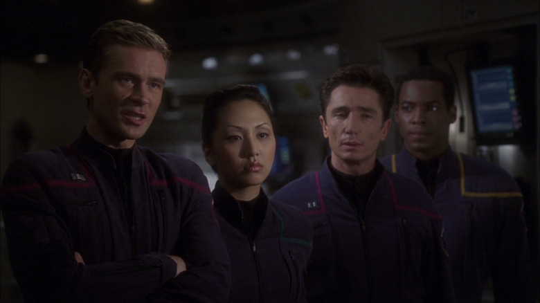 The crew of Enterprise: Connor Trinneer as Trip, Grace Park as Sato, Dominic Keating as Reed, and Anthony Montgomery as Mayweather.