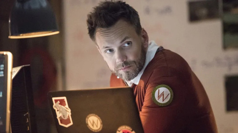 Orson Rudd (Joel McHale) looks up from a desk in The Twilight Zone