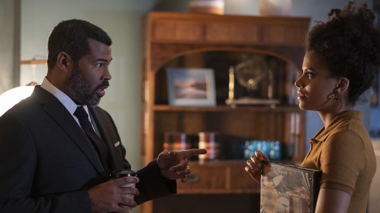 Jordan Peele speaks with Sophie Gelson (Zazie Beetz) on set in The Twilight Zone
