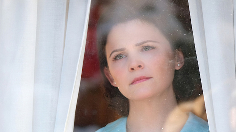 Eve Martin (Ginnifer Goodwin) stares concerned through a window in The Twilight Zone