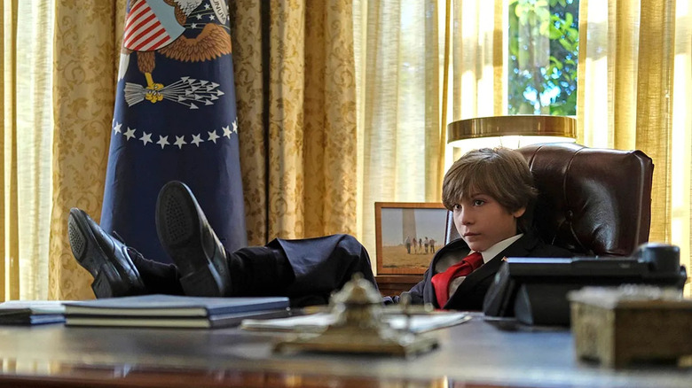 Oliver Foley (Jacob Tremblay) puts his feet on the presidential desk in the Oval Office in The Twilight Zone