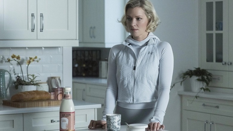 Janet Warren (Gretchen Mol) sits with a bottle of milk in a kitchen in The Twilight Zone