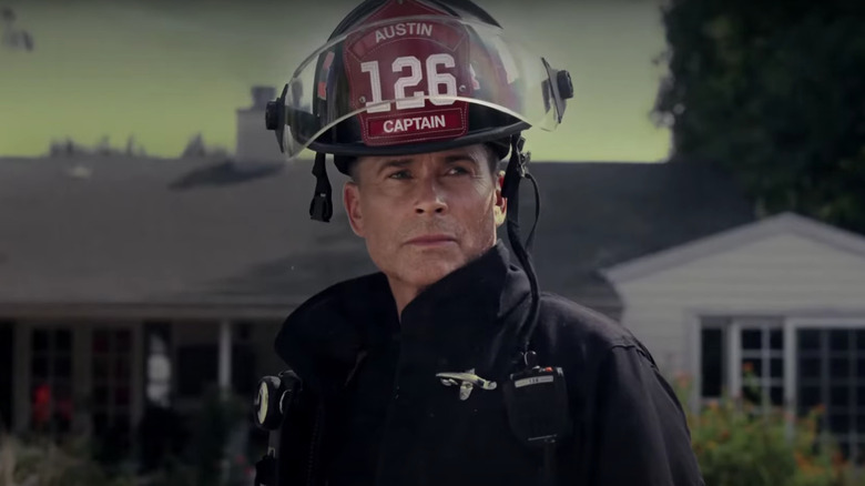 Rob Lowe's Captain Owen Strand wearing a firefighter's helmet on 9-1-1: Lone Star
