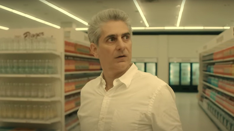 Michael Imperioli's Daniel Hausman-Burger looking horrified in a sterile supermarket on American Horror Stories