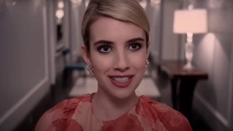 Emma Roberts' Chanel Oberlin smiling mischievously on Scream Queens