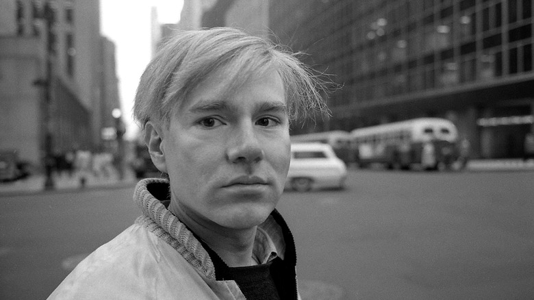 Andy Warhol on a city street on The Andy Warhol Diaries