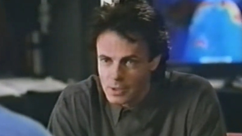 Rick Springfield as Christopher Chance, leaning forward in Human Target.