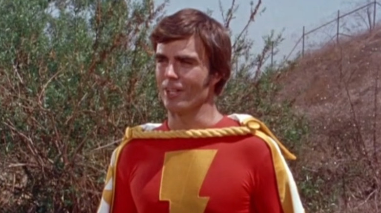 Jackson Bostwick as Captain Marvel, standing near a tree in Shazam!