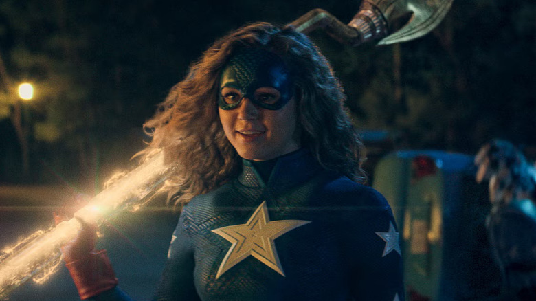 Brec Bassinger as Stargirl, holding her staff over her shoulder in Stargirl.