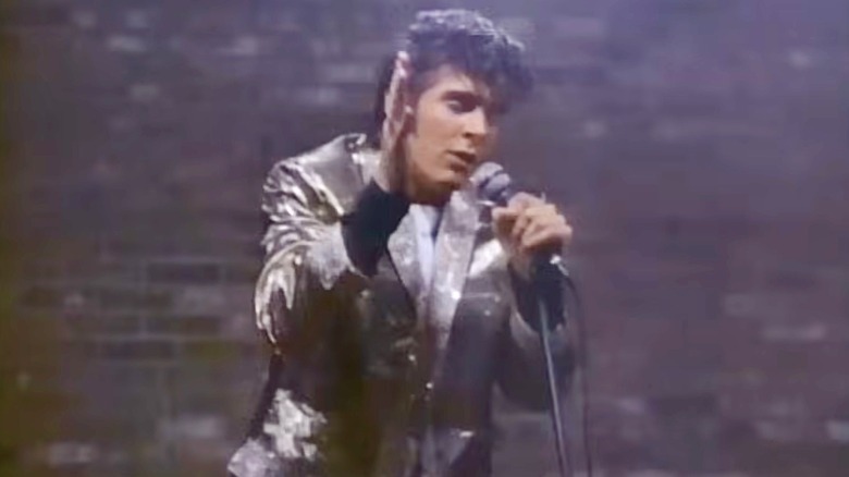 Elvis Presley in shiny jacket, singing