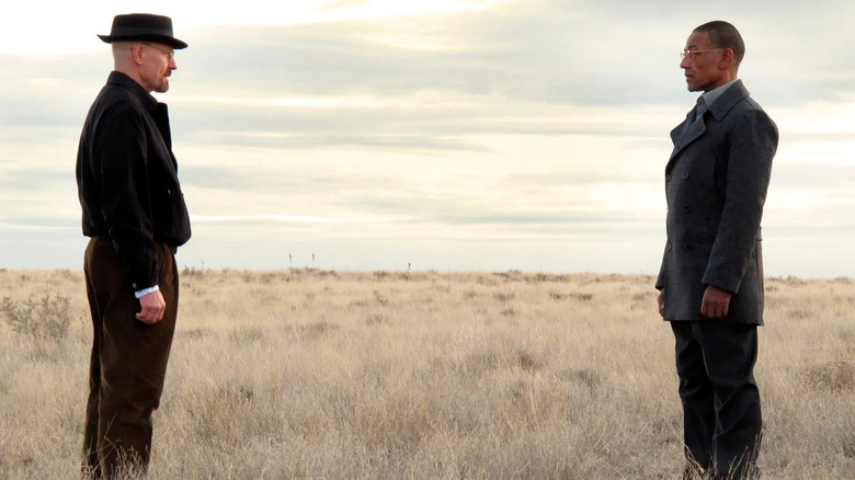 Walter White (Bryan Cranston) and Gus Fring (Giancarlo) stand in front of each other in "Breaking Bad"