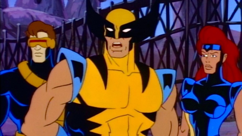 Cyclops, Wolverine, and Jean Grey speaking and looking on