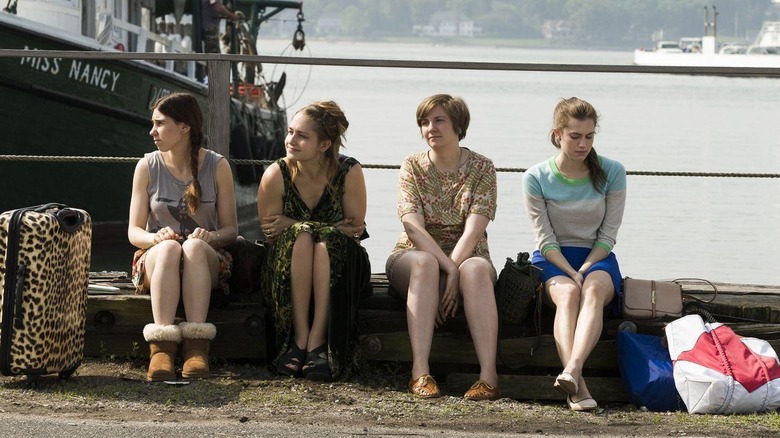Shoshanna, Jessa, Hannah, and Marnie sitting on a dock at the end of the episode 'Beach House' on Girls